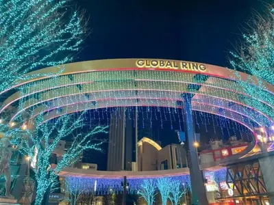 a global ring with christmas lights in front of a building at Fukurou House in Tokyo
