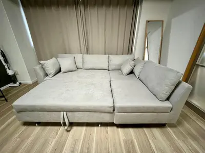 a white couch sitting in a living room at KILN-torigoe2chome INN in Tokyo