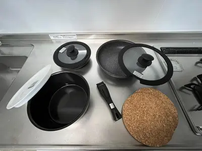 a stove top with pots and pans on it at KILN-torigoe2chome INN in Tokyo