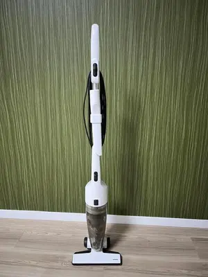 a white robot sitting on the floor in a room at KILN-torigoe2chome INN in Tokyo