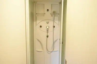 a bathroom with a bath tub in a room at Asakusa Sky House in Tokyo