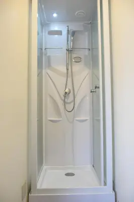 a shower with a glass door in a bathroom at Asakusa Sky House in Tokyo