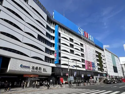 a large building with people walking in front of it at Stay Ikebukuro in Tokyo