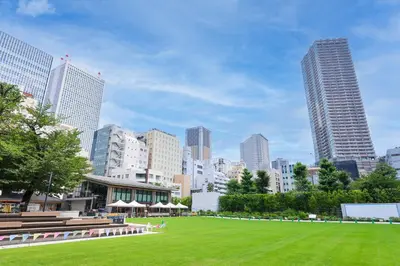 a park in the middle of a city with tall buildings at Stay Ikebukuro in Tokyo