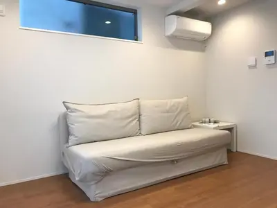 a white bed in a room with a window at \u6728\u6751\u5c4b-\u6c60\u888b Kimuraya-Ikebukuro in Tokyo