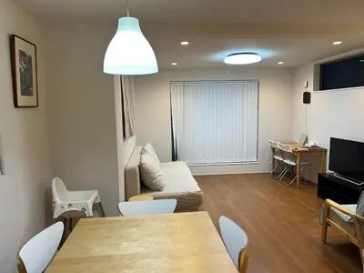 a living room with a couch and a table at \u6728\u6751\u5c4b-\u6c60\u888b Kimuraya-Ikebukuro in Tokyo