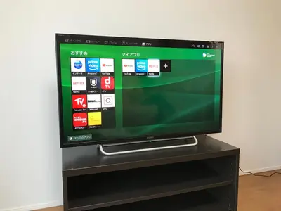 a flat screen tv sitting on a black stand at \u6728\u6751\u5c4b-\u6c60\u888b Kimuraya-Ikebukuro in Tokyo