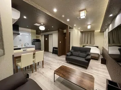 a living room with a couch and a bed and a table at Oyado Nene, Tokyo Heiwajima - Vacation STAY 23423v in Tokyo