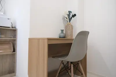 a white chair sitting next to a wooden desk at Cozy Nest Nakano 2 stops 5 min to Ikebukuro 7 stops to Shinjuku 15 min new 1LDK in Tokyo