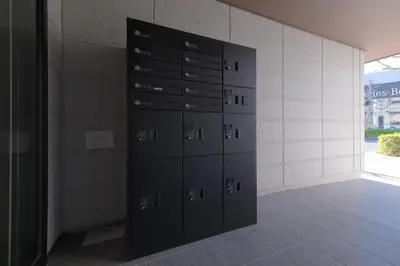 a row of lockers in a room with a wall at Cozy Nest Nakano 2 stops 5 min to Ikebukuro 7 stops to Shinjuku 15 min new 1LDK in Tokyo