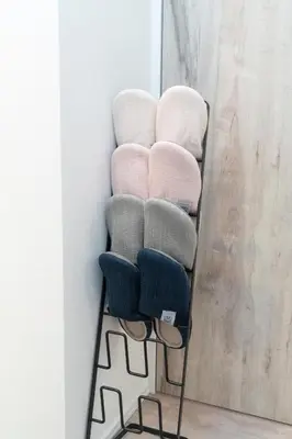a towel rack with four towels on it at RIAUS \u65b0\u7bc9\u4e00\u8ed2\u5bb6\u8cb8\u5207 \u6700\u59276\u540d family\u6b53\u8fce \u7a7a\u6e2f\u3084\u89b3\u5149\u5730\u76f4\u901a in Tokyo