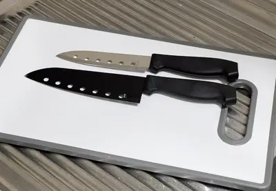 a knife and a black bow tie on a cutting board at \u65b0\u4e0a\u91ce202 \u7ad9\u6b65\u884c7\u5206\u949f\u7a3b\u6210\u753a\u7ad92\u5206\u949f in Tokyo