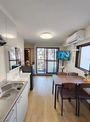 a kitchen with a table and a dining room at YKO Guest house in Akihabara 60 square meters, 3 bedrooms, 1 living rooms elevator, sky tree view in Tokyo