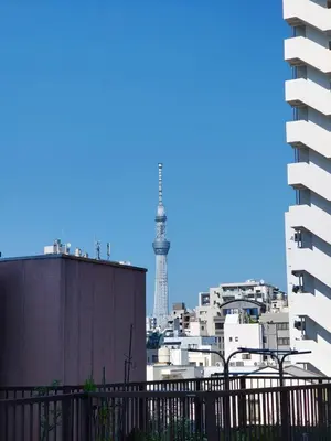 a view of the eiffel tower from a building at YKO Guest house in Akihabara 60 square meters, 3 bedrooms, 1 living rooms elevator, sky tree view in Tokyo