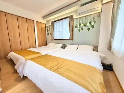 two beds in a small room with at \u6effJR Soubusen Hirai 5mins walk Guest house! 2LDK,Max 8PP! Direct access to Kinshicyo,Akihabara,Shinjyuku! in Tokyo