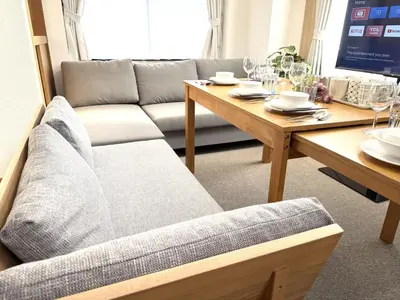 a living room with a couch and a table at \u6effJR Soubusen Hirai 5mins walk Guest house! 2LDK,Max 8PP! Direct access to Kinshicyo,Akihabara,Shinjyuku! in Tokyo
