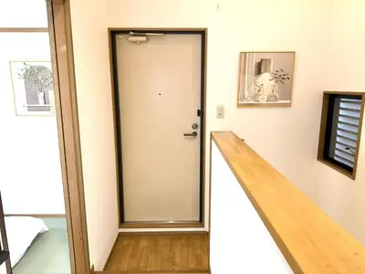 a hallway with a door and a stairway at \u6effJR Soubusen Hirai 5mins walk Guest house! 2LDK,Max 8PP! Direct access to Kinshicyo,Akihabara,Shinjyuku! in Tokyo