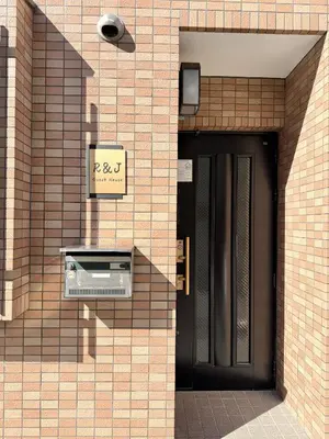 a building with a door and a sign on it at \u6effJR Soubusen Hirai 5mins walk Guest house! 2LDK,Max 8PP! Direct access to Kinshicyo,Akihabara,Shinjyuku! in Tokyo