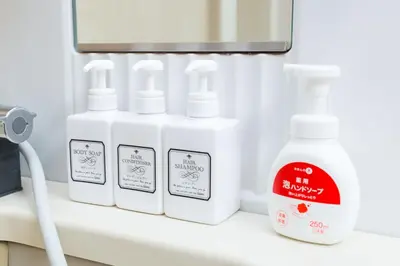a shelf with four bottles of detergents on it at Shinjuku sprem in Tokyo