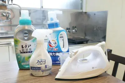a counter with two bottles of cleaner and a hair dryer at \u6b63\u6804\u30cf\u30a4\u30c4101 in Tokyo