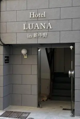 a building with a hotel lzuota sign on it at Hotel LUANA in Shin-Nakano in Tokyo