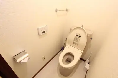 a bathroom with a toilet with the lid up at Hotel LUANA in Shin-Nakano in Tokyo