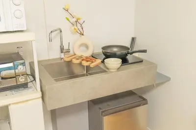 a kitchen counter with a sink and a frying pan at 3-person mansion in Shinjuku Kabukicho train 8 mins in Tokyo