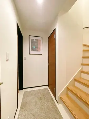 a hallway with a door and stairs in a house at Home Stroy in Tokyo - Luxury Villa Minowa&Ueno-三ノ輪一戸建て&東京屋語 in Tokyo