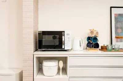 a microwave sitting on top of a kitchen counter at Home Stroy in Tokyo - Luxury Villa Minowa&Ueno-三ノ輪一戸建て&東京屋語 in Tokyo