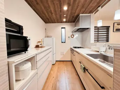a kitchen with a sink and a refrigerator at Home Stroy in Tokyo - Luxury Villa Minowa&Ueno-三ノ輪一戸建て&東京屋語 in Tokyo