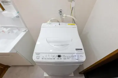 a white toilet in a bathroom next to a sink at FINOA Residential Suite Higashikanamachi in Tokyo