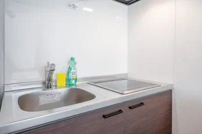 a kitchen with a sink and a counter top at \u97f3\u7fbds\u30b0\u30ec\u30fc\u30b9 in Tokyo