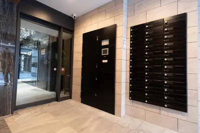 a wine cellar with a wall filled with wine glasses at KINSHICHO Tokyo Holiday Hotel in Tokyo