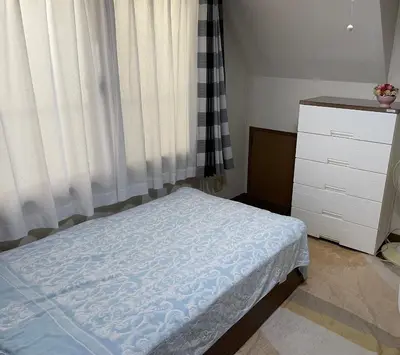 a small bedroom with a bed and a dresser at Homestay at M's House Not entire property just one room in Tokyo