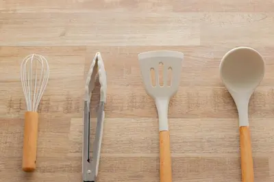 a group of utensils sitting on top of a table at unito residence TSUKIJI in Tokyo