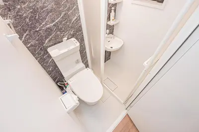 a small bathroom with a toilet and a sink at Japan House Skytree \u30f4\u30a3\u30e9\u8cb8\u5207 A\u9928 in Tokyo