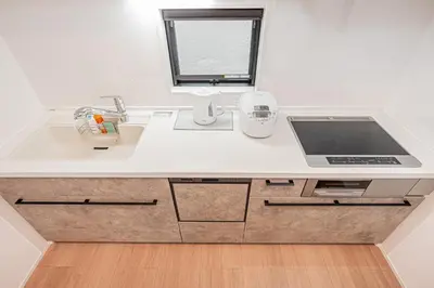 a white kitchen with a sink and a window at Japan House Skytree \u30f4\u30a3\u30e9\u8cb8\u5207 A\u9928 in Tokyo