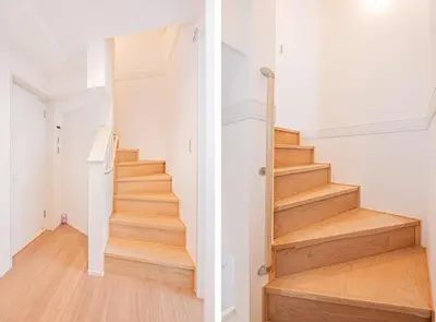 a staircase in a home with white walls and wooden floors at Japan House Skytree \u30f4\u30a3\u30e9\u8cb8\u5207 A\u9928 in Tokyo