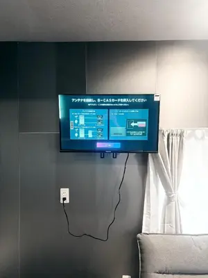 a flat screen tv hanging on a wall at Ikebukuro\u6b63\u548c\u5eb5 in Tokyo