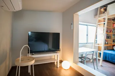 a living room with a large television and a table at KIKA STAY - Tokyo 202 with Car park in Tokyo