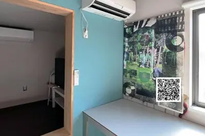 a room with a wall with a painting on the wall at KIKA STAY - Tokyo 202 with Car park in Tokyo