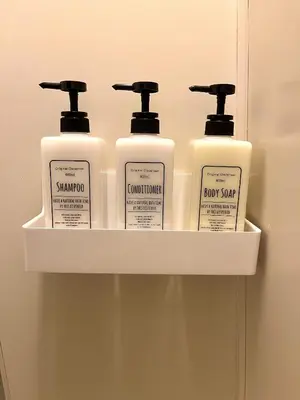 a shelf with four bottles of shampoo and soap at S,F, Heights - Vacation STAY 18516 in Tokyo