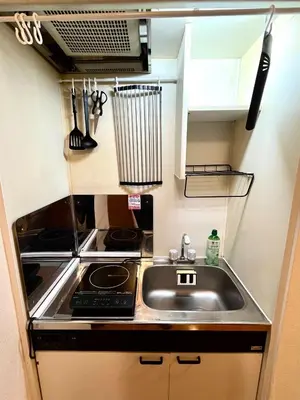a small kitchen with a sink and a stove at S,F, Heights - Vacation STAY 18516 in Tokyo