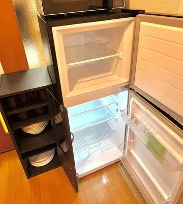 an empty refrigerator with its door open in a kitchen at S,F, Heights - Vacation STAY 18516 in Tokyo