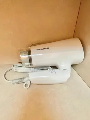 a hair dryer is sitting on the floor at YMK Oshiage 4B in Tokyo
