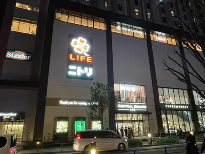 a car parked in front of a building at night at YMK Oshiage 4B in Tokyo