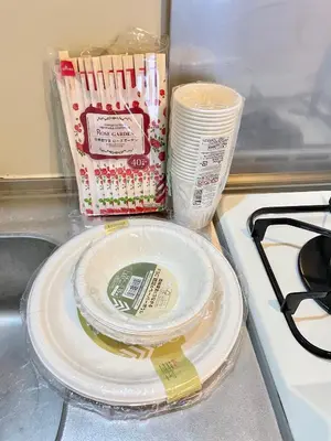 a stack of plates sitting on top of a counter at YMK Oshiage 5B in Tokyo
