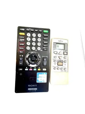 a sony remote control next to a cell phone at Ueno Sky Garden in Tokyo