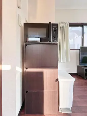 a microwave oven sitting on top of a refrigerator at Ueno Sky Garden in Tokyo