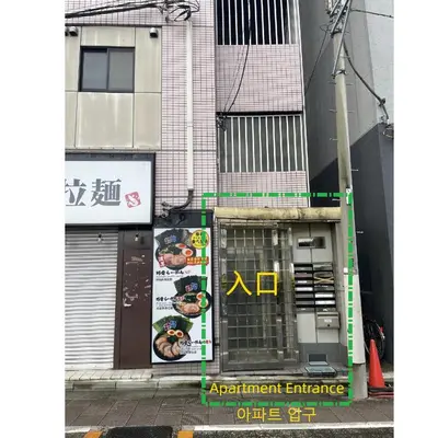 an entrance to a building with an apartment entrance at YMK Oshiage 7A in Tokyo